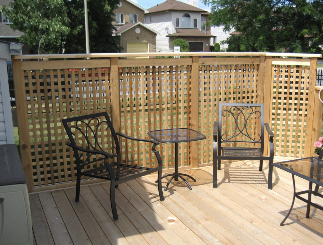 Deck Privacy Lattice Screen installed in Nepean, Ontario by Fence Masters Ottawa — Cedar lattice privacy screen with capped top rail framing a raised deck seating area