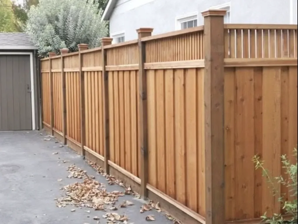 Capped cedar privacy fence with visible wood grain along an Ottawa backyard.